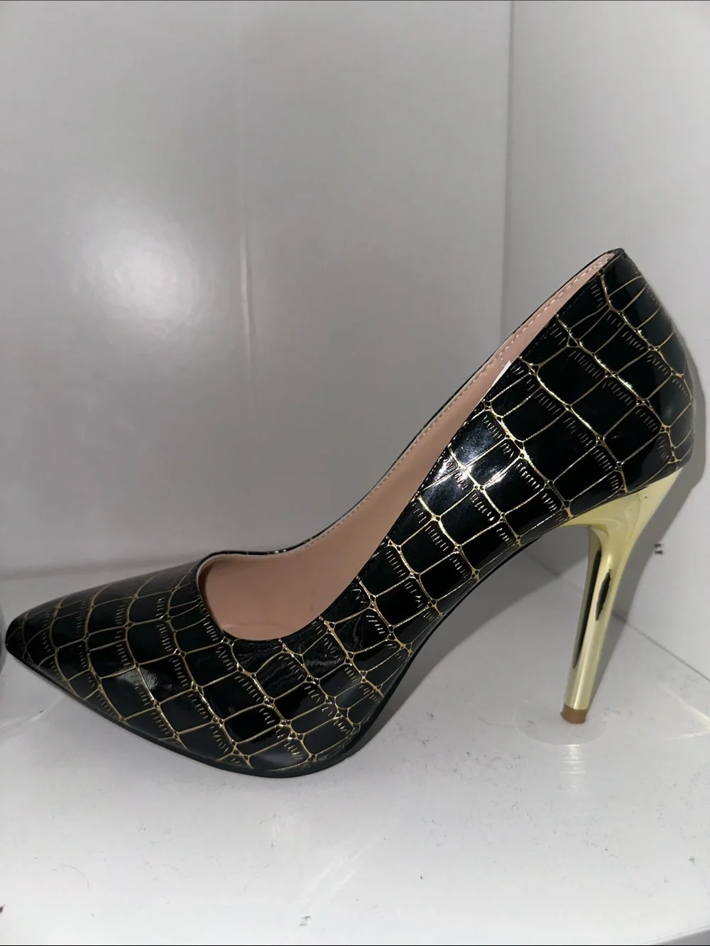 Black and gold heels